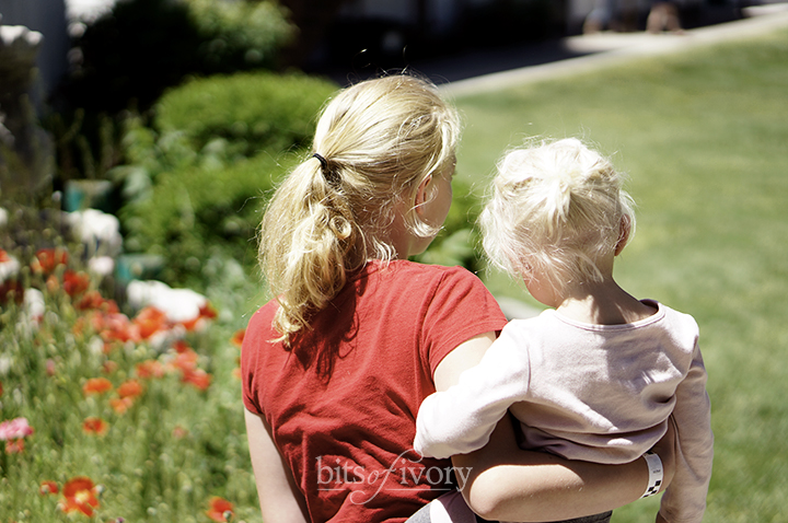 Teenage Babysitter holding a toddler