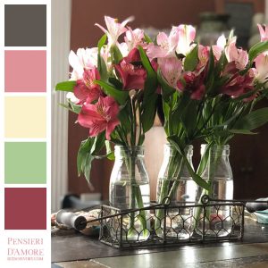 pink and red flowers in glass vases with color blocks for color inspiration, titled pensieri d'amore